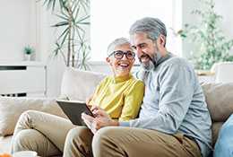 Photo of a couple researching about planned giving. Link to Life Stage Gift Planner Ages 60-70 Situations. Photo of a couple researching about planned giving. Link to Life Stage Gift Planner Ages 60-70 Situations.