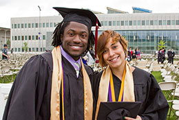 Photo of two graduates. Link to What to Give. What-to-Give.jpg